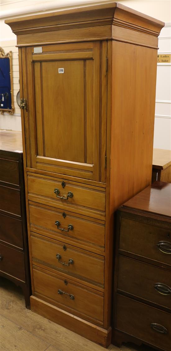 A late Victorian narrow pine cupboard W.61cm